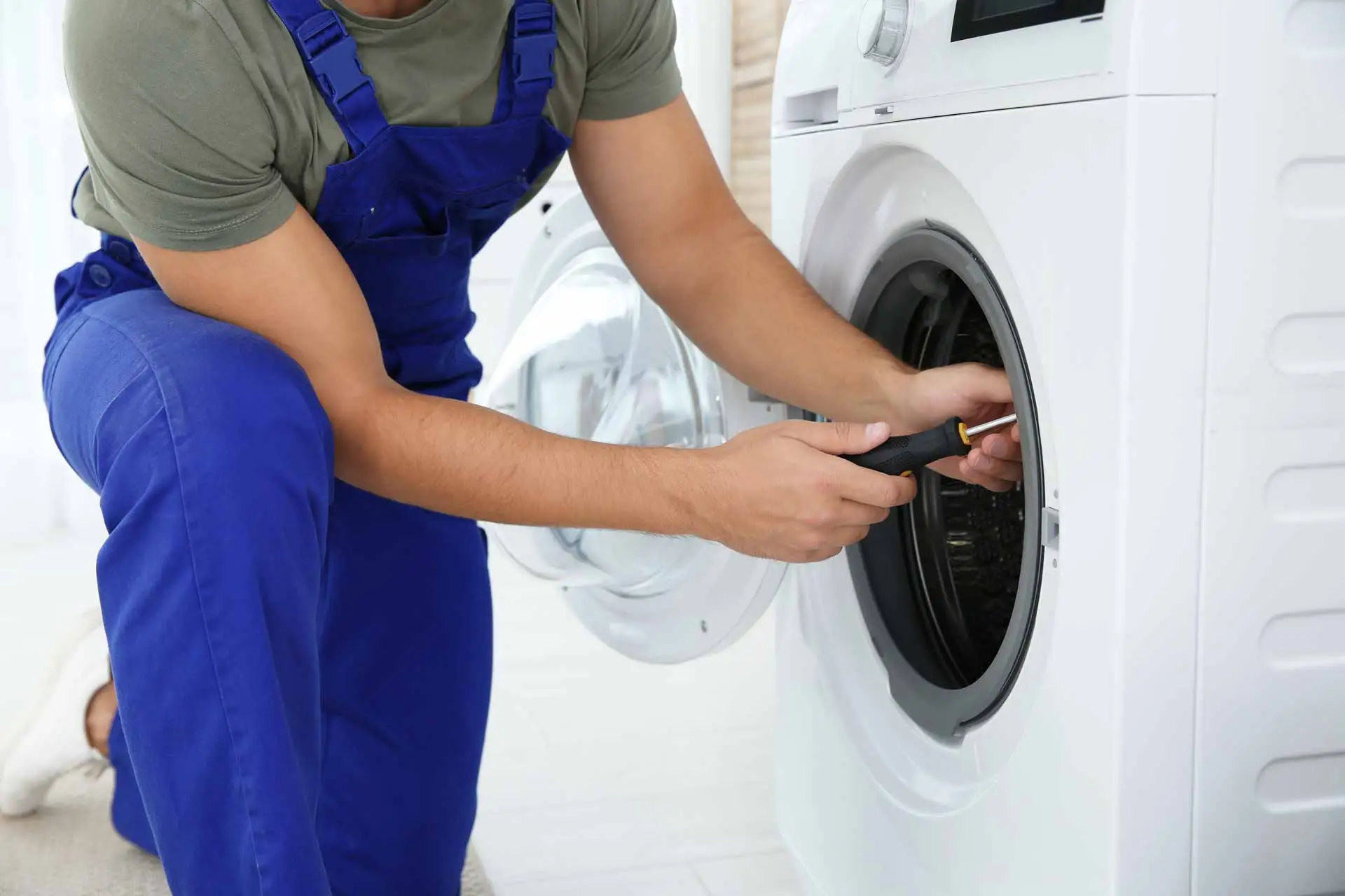 Certified Mechanical technician repairing a dryer in Toronto